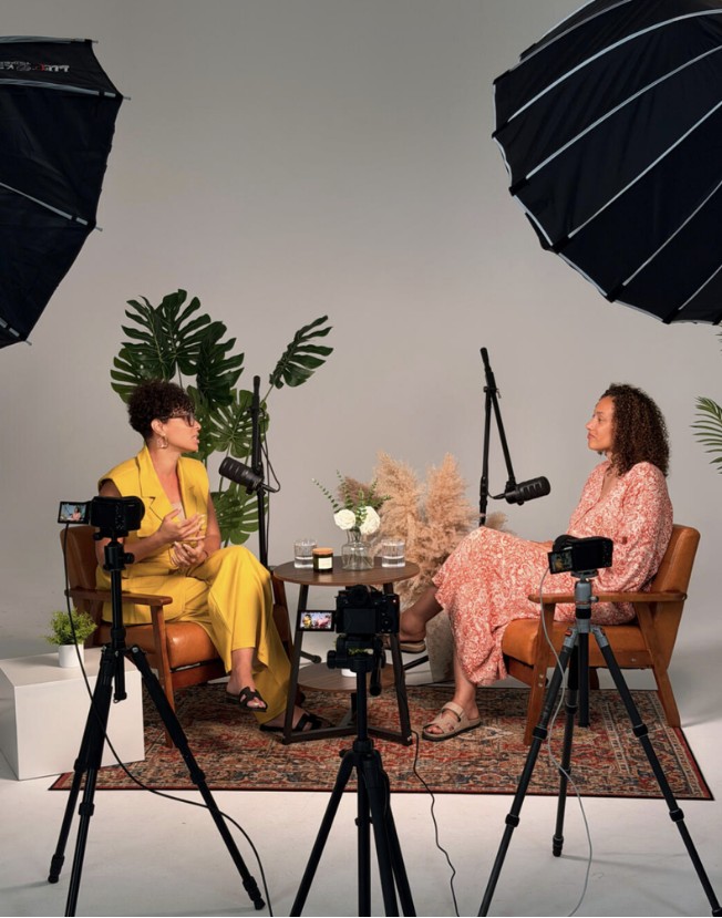 Two women recording a podcast in a studio, event reference