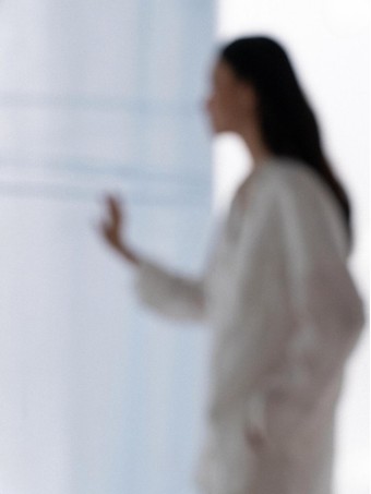 Softly blurred figure facing away research reference