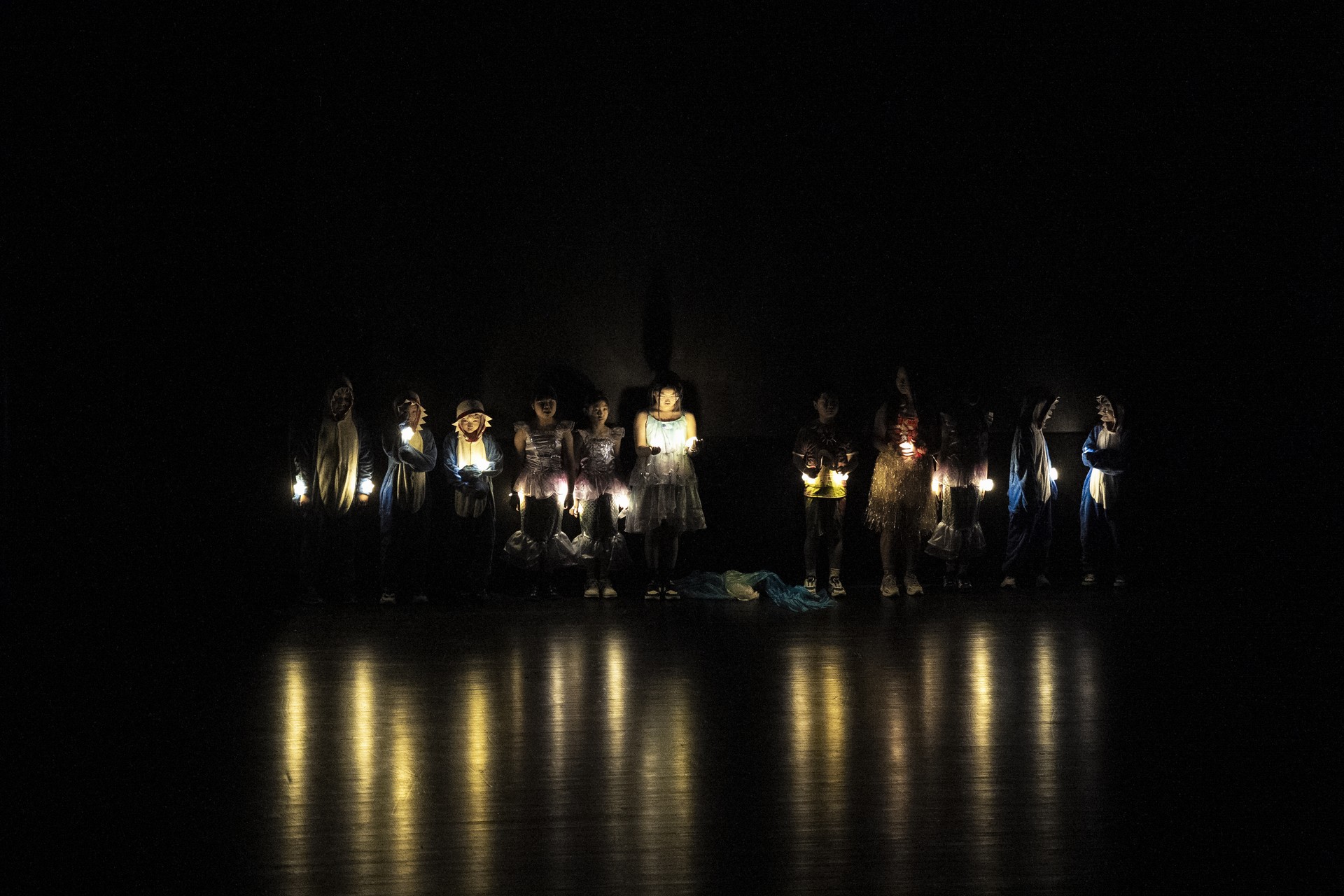 The musical performance on a dark stage